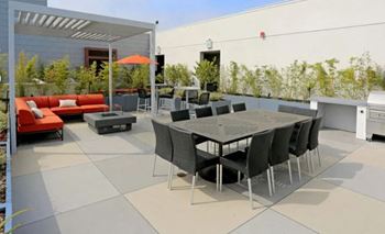 a patio with a table and chairs